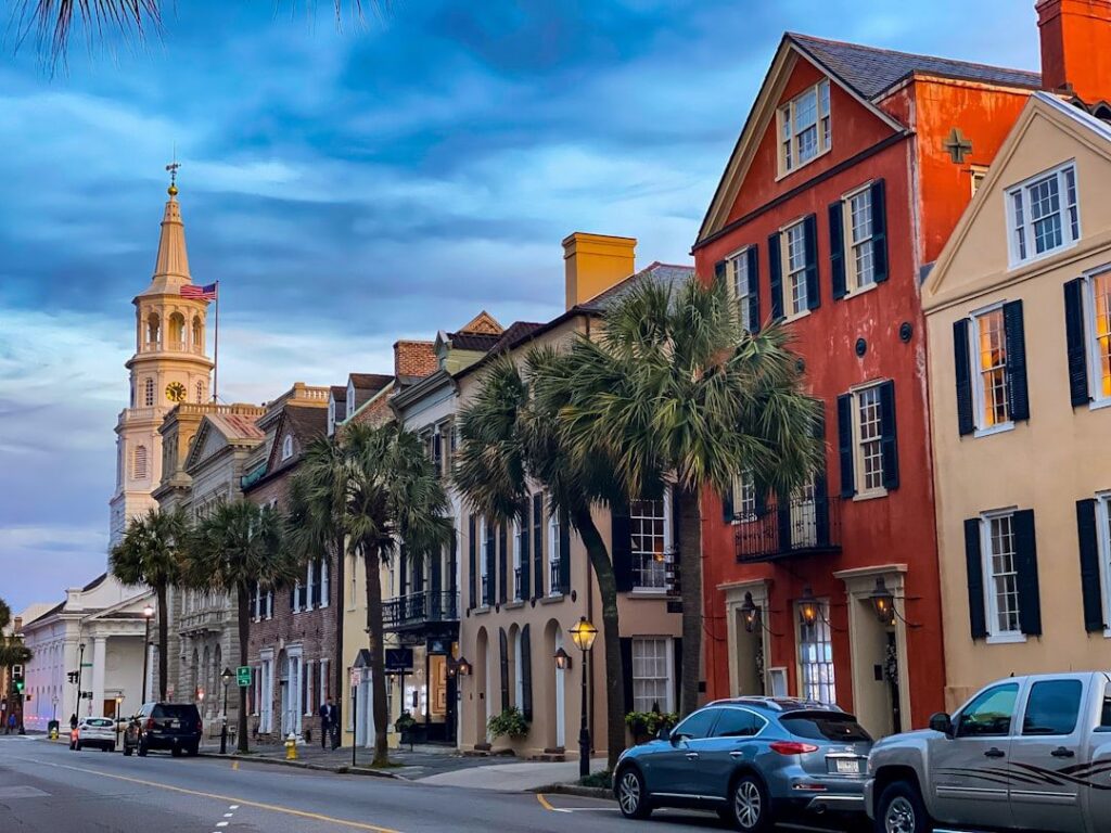Family moving into historic Charleston home with moving coordinator, storage unit, and welcoming neighbors
